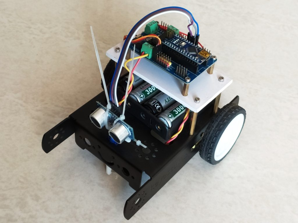 Ultrasonic obstacle avoiding robot using arduino nano and nano robot controller board